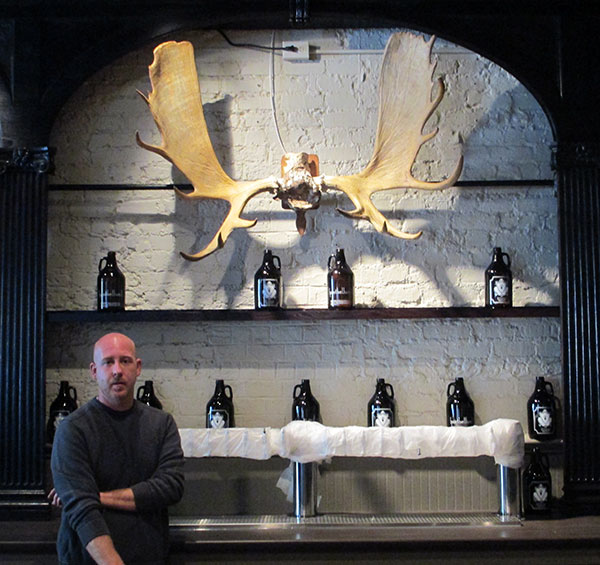 Postbellum general manager Ryan Koontz with a pair of moose antlers that will be familiar to former Mulligan's patrons. (Photos by Michael Thompson)