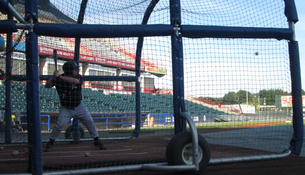 An M&T employee taking some big cuts during batting practice. 