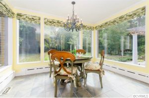The home includes a sunroom and a screen porch. 