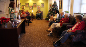 The property's staff and residents sing Christmas carols. 
